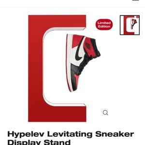 Levitating shoe stand Red new in box. Never opened